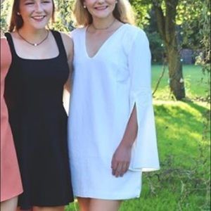 White mini dress with sleeves, fun slits